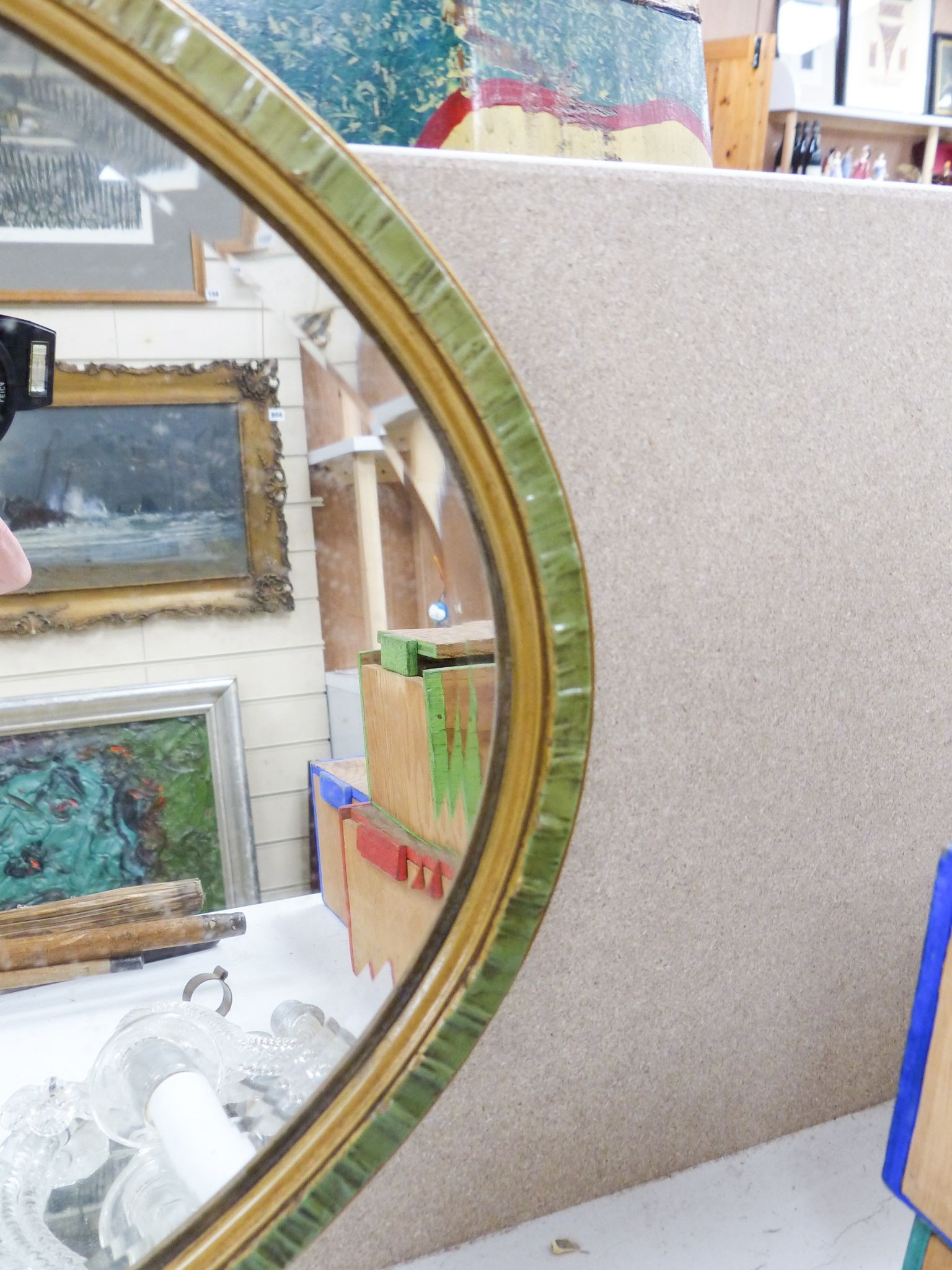 An oval painted barbola wall mirror 71cm